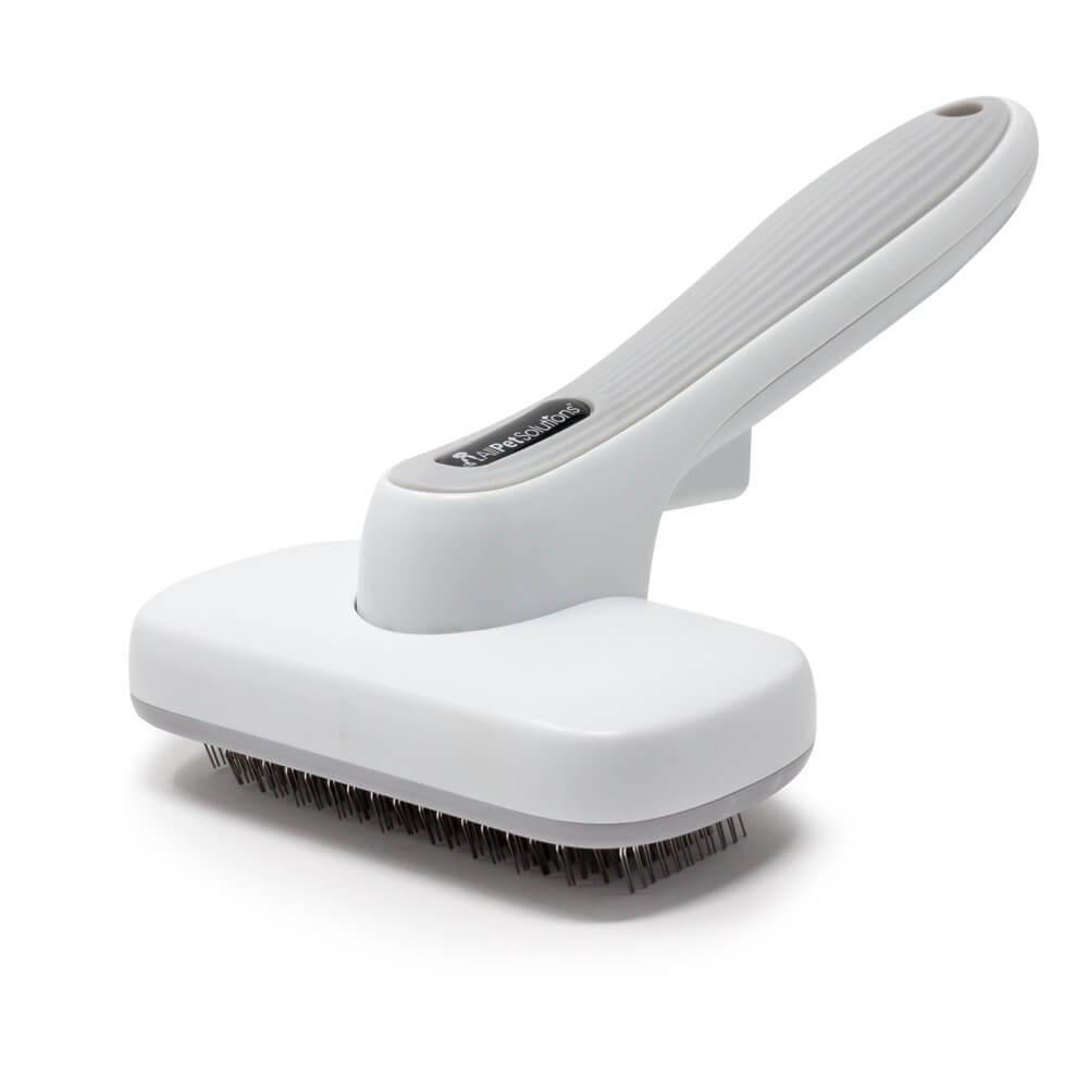 Self cleaning slicker store brush